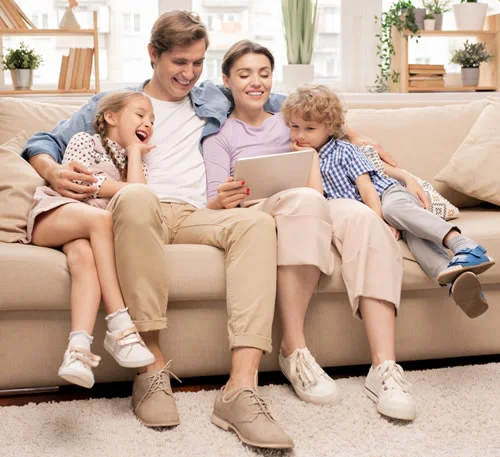 Smiling family in a mold-free Lake Geneva, WI home, enjoying peace of mind after Healthy Home Mold Services’ expert mold inspection and remediation